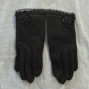 Women’s Rinascente brand black gloves size small with flower detail.